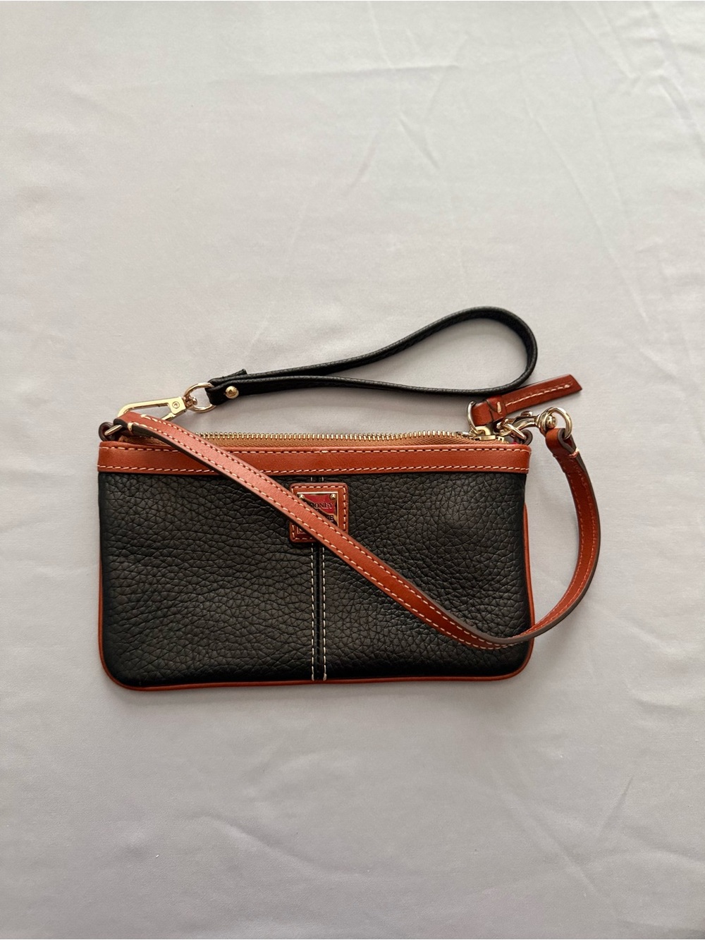 Dooney & Bourke Black Pebble Leather Wristlet with Brown Trim and Strap